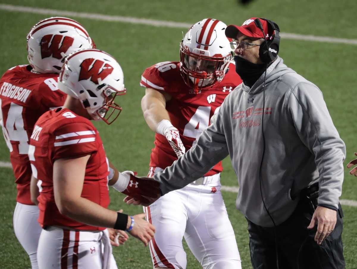 Wisconsin head coach Paul Chryst congratulates his team after a touchdown against Illinois on Oct. 23. Wisconsin defeated Illinois 45-7 on that Friday night opener for the Big Ten Conference.