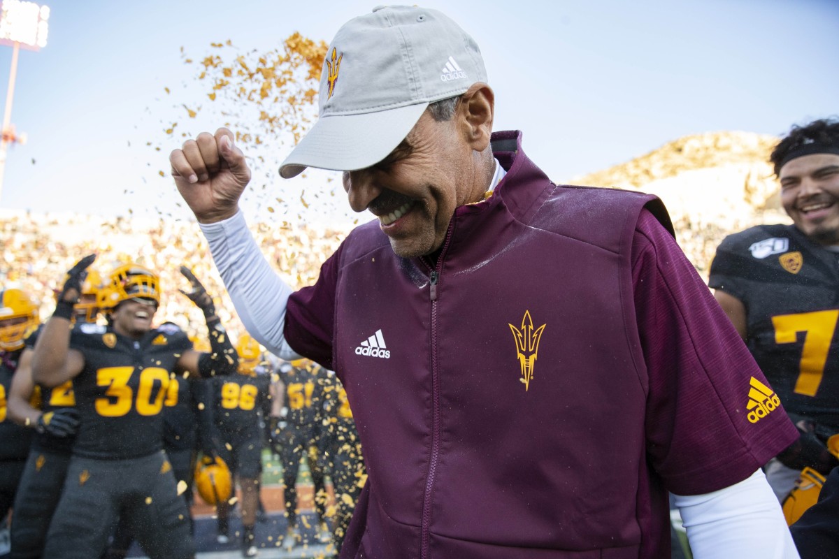 Dec 31, 2019; El Paso, Texas, USA; Arizona State Sun Devils head coach Herm Edwards is doused by Frosted Flakes by his players moments after defeating the Florida State Seminoles 20-14 in the Sun Bowl.