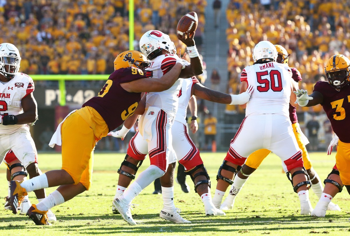 Arizona State defensive lineman Jermayne Lole forces a fumble by Utah quarterback Jason Shelley in the second half on Nov. 3 at Sun Devil Stadium. Utah Vs Arizona State 2018