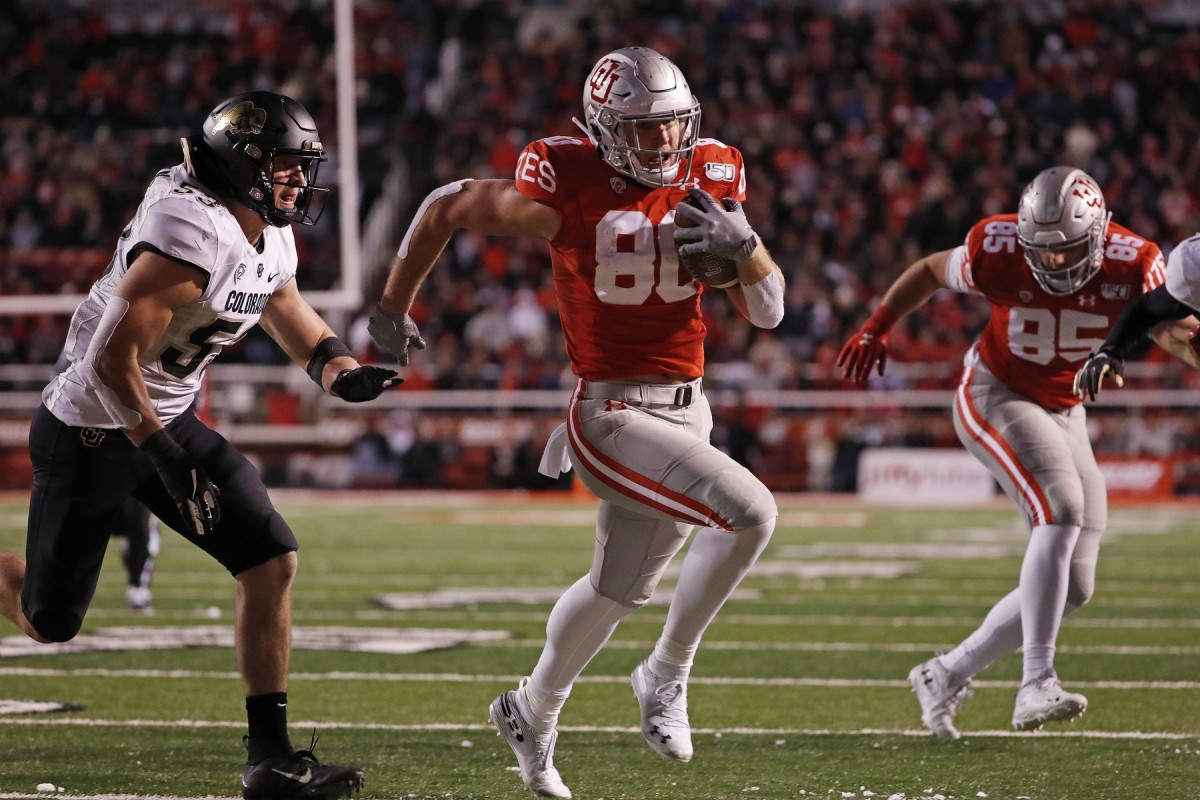 Nov 30, 2019; Salt Lake City, UT, USA; Utah Utes tight end Brant Kuithe (80) past Colorado Buffaloes linebacker Nate Landman (53) for a fourth quarter touchdown at Rice-Eccles Stadium.