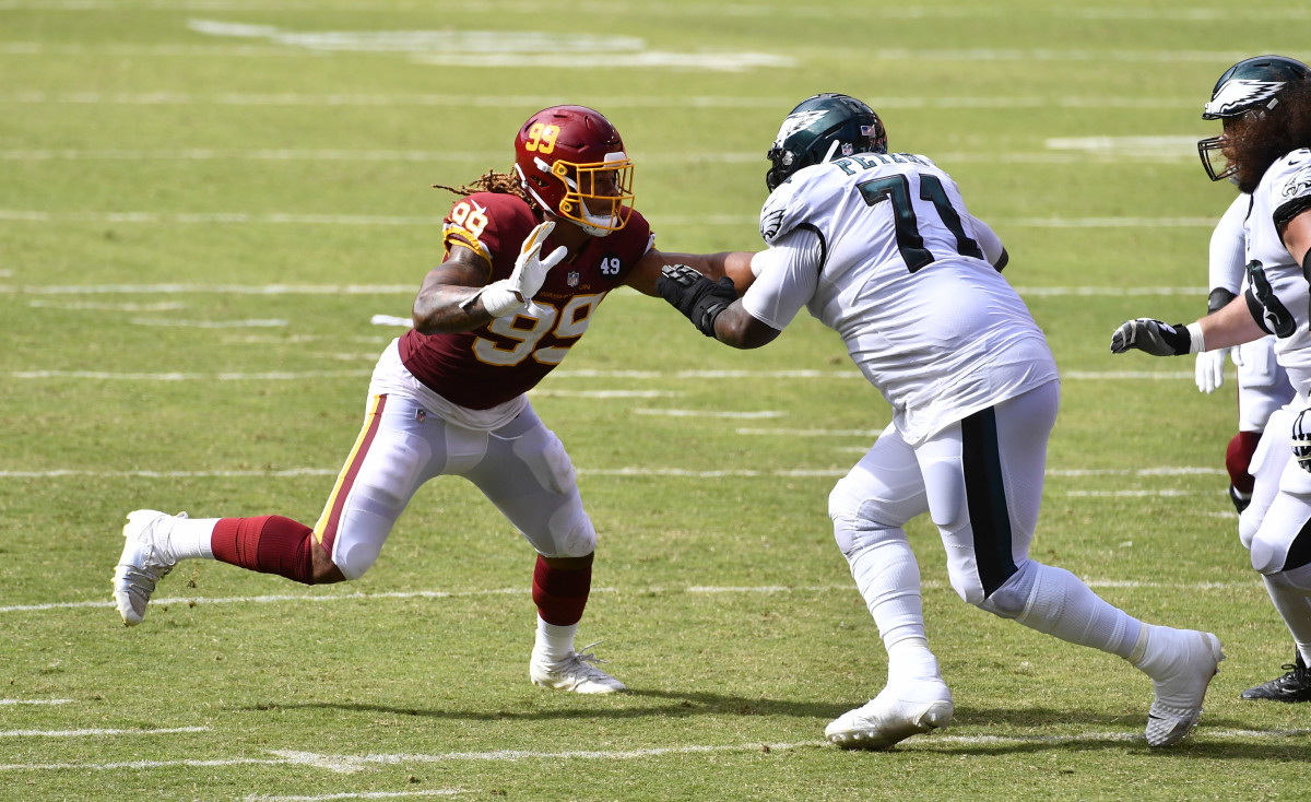 Jason Peters (71) blocks defensive end Chase Young (99) during a 2020 game at at FedExField.