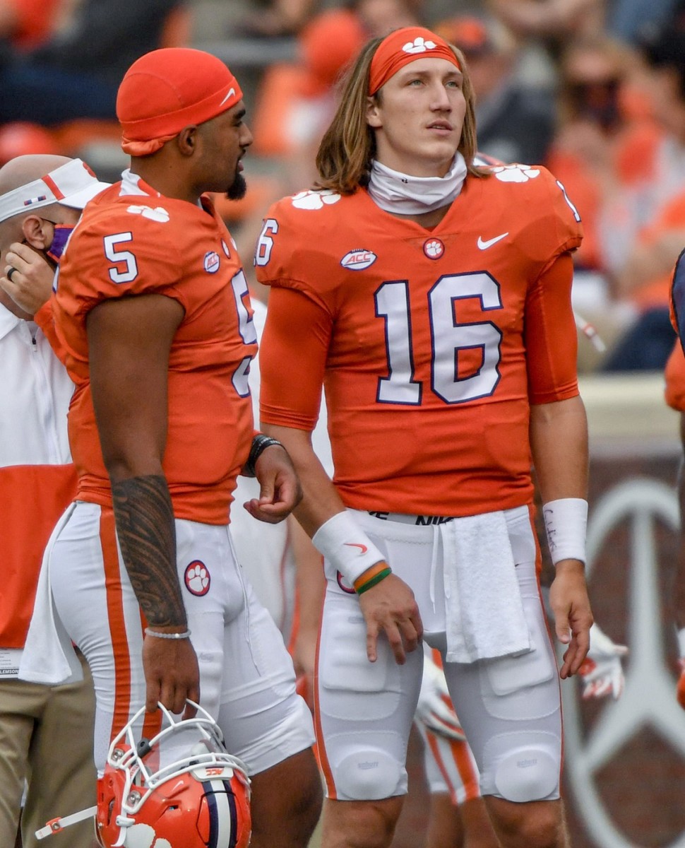 Clemson quarterbacks Trevor Lawrence (16) and D.J. Uiagalelei watch from the sideline against The Citadel. (© Ken Ruinard via Imagn Content Services, LLC)