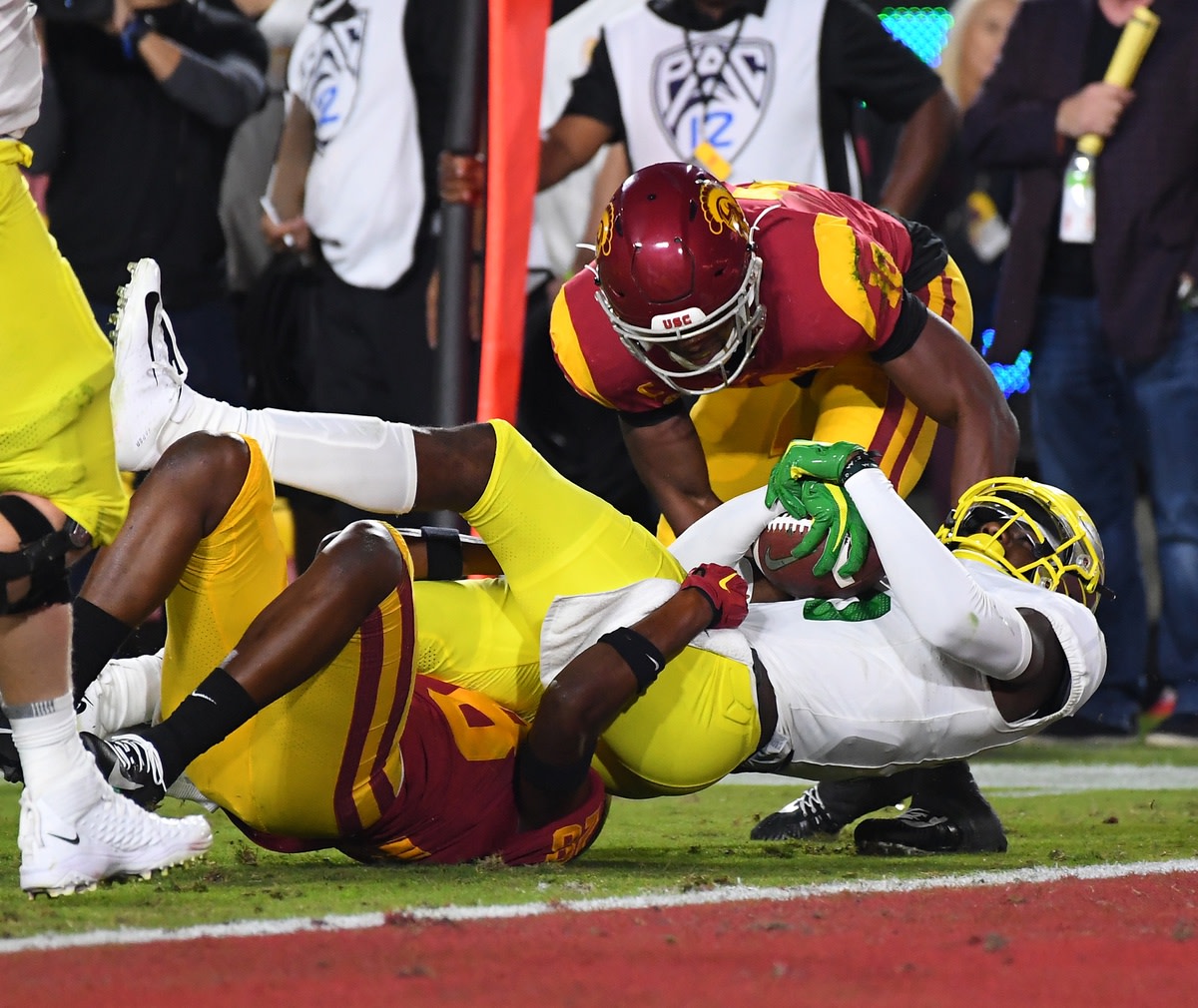 Nov 2, 2019; Los Angeles, CA, USA; Oregon Ducks wide receiver Juwan Johnson (6) runs the ball before he is stoped at the 1 yard line by USC Trojans safety C.J. Pollard (28) in the first half of the game at the Los Angeles Memorial Coliseum.