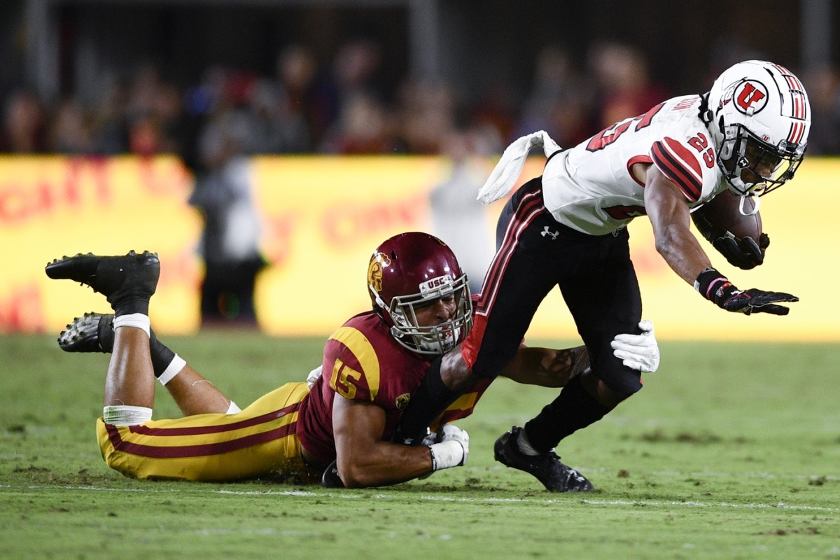 Sep 20, 2019; Los Angeles, CA, USA; Southern California Trojans safety Talanoa Hufanga (15) tackles Utah Utes wide receiver Jaylen Dixon (25) during the first half at Los Angeles Memorial Coliseum.