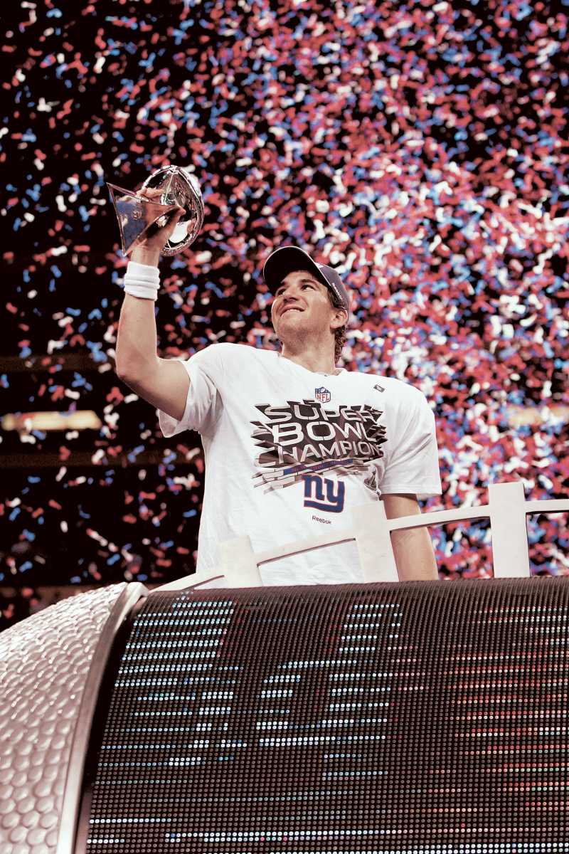 Eli Manning holding the Lombardi Trophy after being named Super Bowl XLVI's MVP.