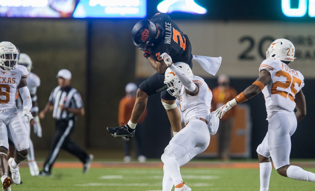 Wallace makes a senational catch druing the fourth quarter against Texas. Wallace finished with 11 receptions for 187-yards and two touchdowns. 