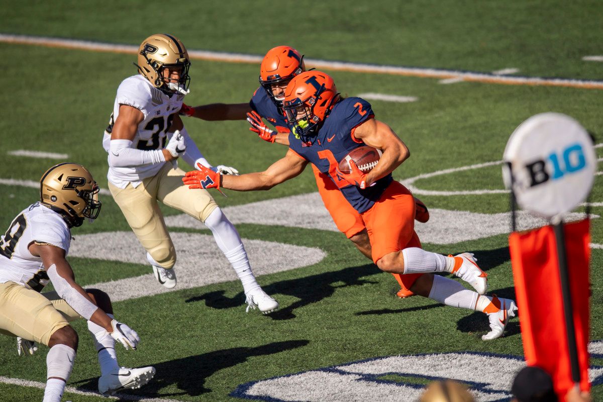 Illinois Fighting Illini running back Chase Brown (2) runs the ball against the Purdue Boilermakers during the first half at Memorial Stadium. Brown finished with 73 yards on just 11 carries in the 31-24 loss to Purdue.