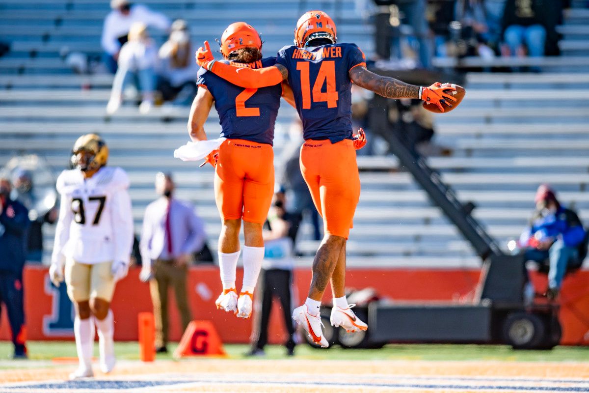 Illinois Fighting Illini wide receiver Brian Hightower (14) celebrates his touchdown with running back Chase Brown (2) during the second half at Memorial Stadium.