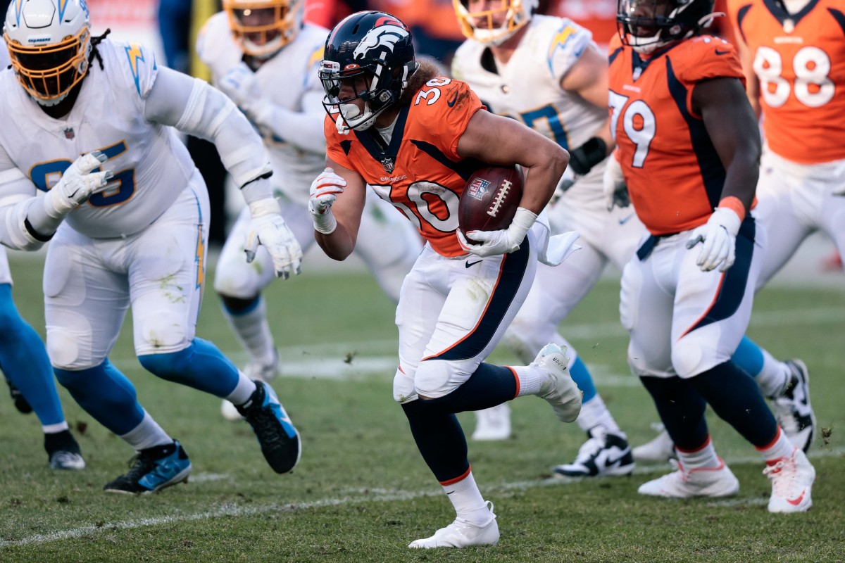 Denver Broncos running back Phillip Lindsay (30) runs the ball in the third quarter against the Los Angeles Chargers at Empower Field at Mile High.