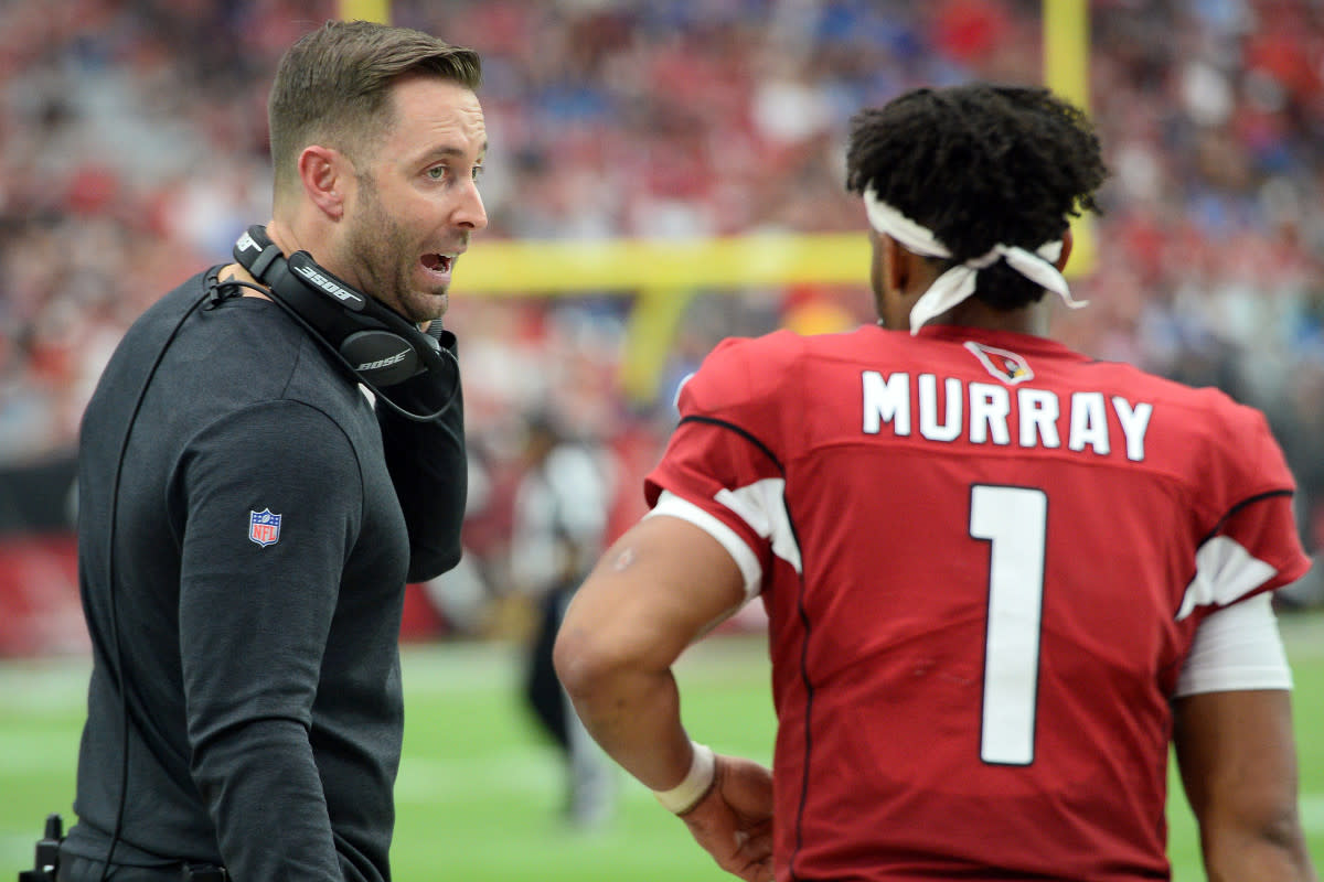 Arizona Cardinals head coach Kliff Kingsbury gives directions to rookie quarterback, Kyler Murray (1), in a 2019 game against the Lions.  A former quarterback, Kingsbury has been entrusted to develop Murray into a star.