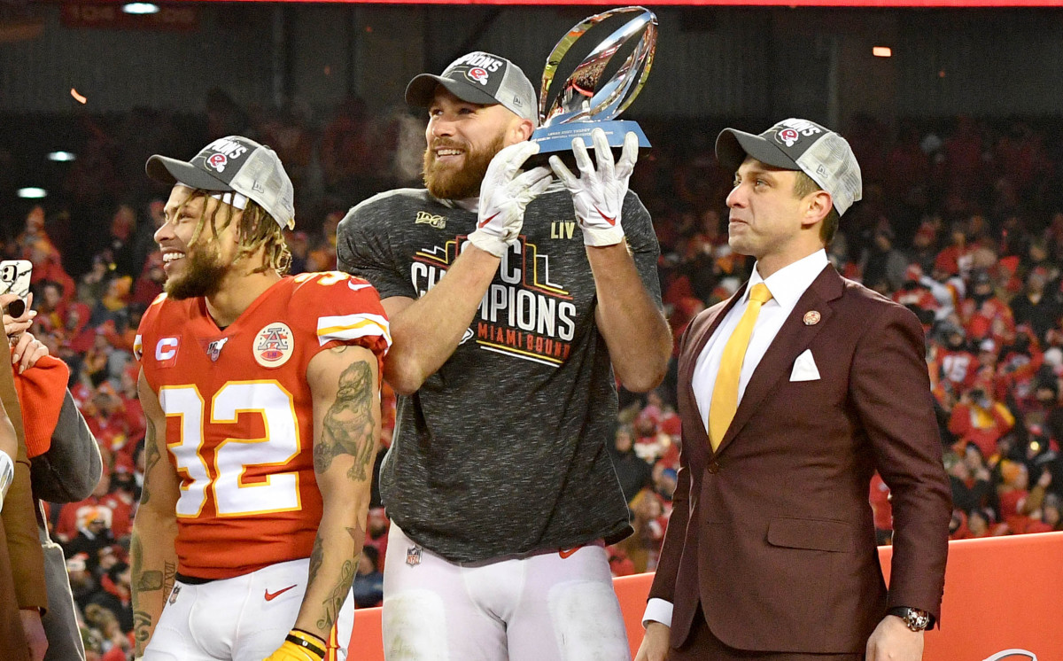 Jan 19, 2020; Kansas City, Missouri, USA; Kansas City Chiefs strong safety Tyrann Mathieu (32) and tight end Travis Kelce (87) and general manager Brett Veach (left to right) celebrate on stage after the AFC Championship Game against the Tennessee Titans at Arrowhead Stadium. Mandatory Credit: Denny Medley-USA TODAY Sports
