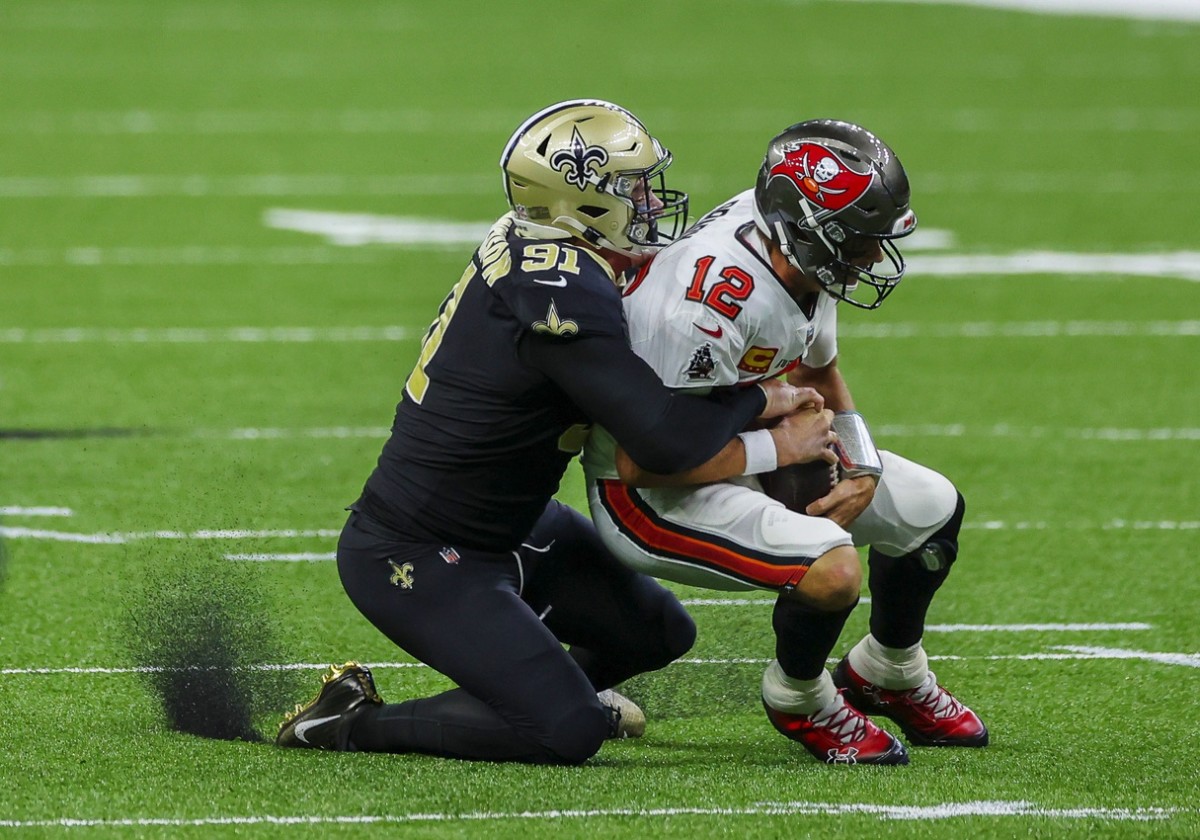 Sep 13, 2020; New Orleans, Louisiana, USA; New Orleans Saints defensive end Trey Hendrickson (91) sacks Tampa Bay Buccaneers quarterback Tom Brady (12) during the second quarter at the Mercedes-Benz Superdome. Mandatory Credit: Derick E. Hingle-USA TODAY 