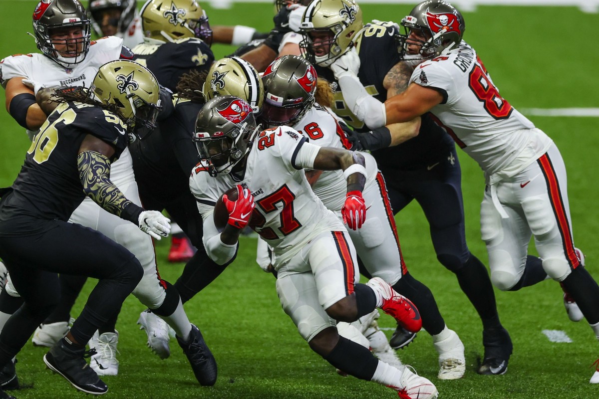 Sep 13, 2020; New Orleans, Louisiana, USA; Tampa Bay Buccaneers running back Ronald Jones II (27) runs against the New Orleans Saints during the first quarter at the Mercedes-Benz Superdome. Mandatory Credit: Derick E. Hingle-USA TODAY 