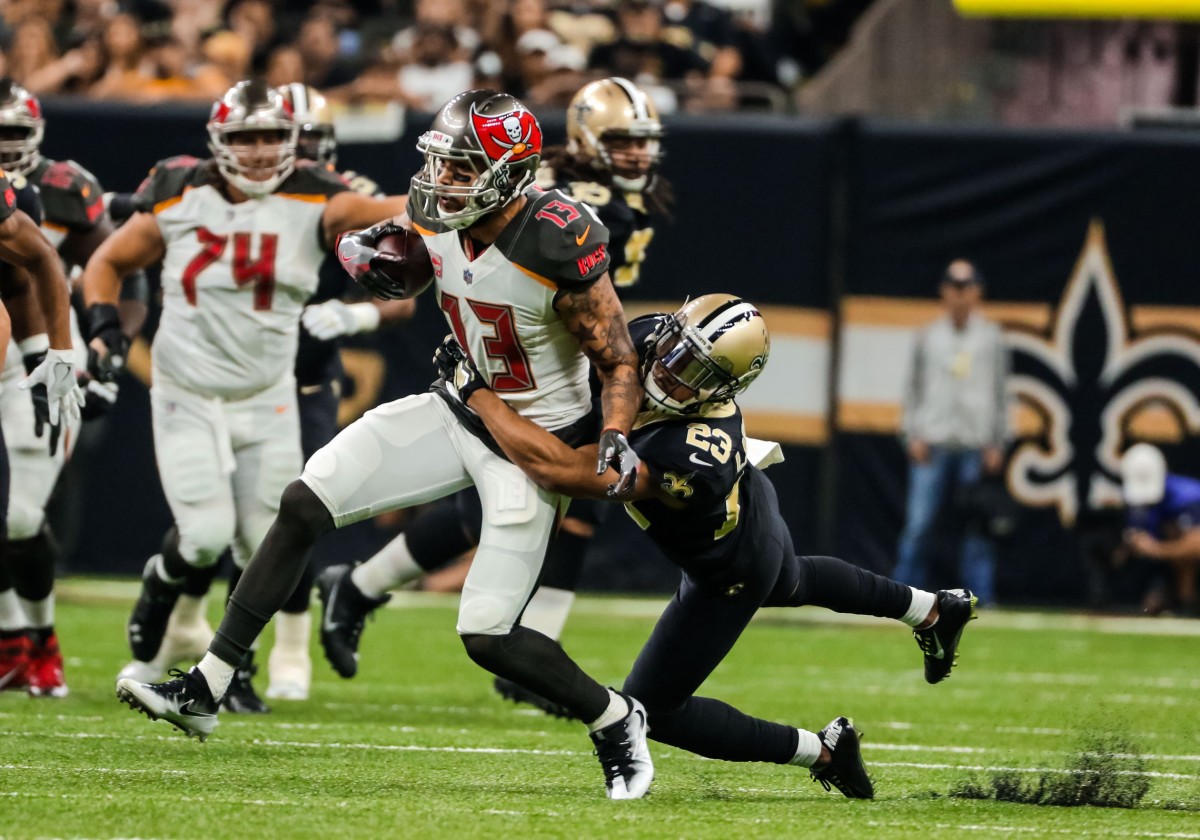 Nov 5, 2017; New Orleans, LA, USA; New Orleans Saints cornerback Marshon Lattimore (23) tackles Tampa Bay Buccaneers wide receiver Mike Evans (13) during the first half of a game at the Mercedes-Benz Superdome. Mandatory Credit: Derick E. Hingle-USA TODAY 