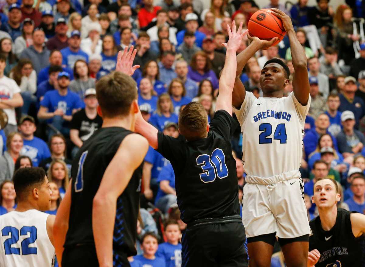 Aminu Mohammed, of Greenwood, puts up the shot during the Blue Jays' quarterfinal game against Hartville at Republic High School on Saturday, March 7, 2020.