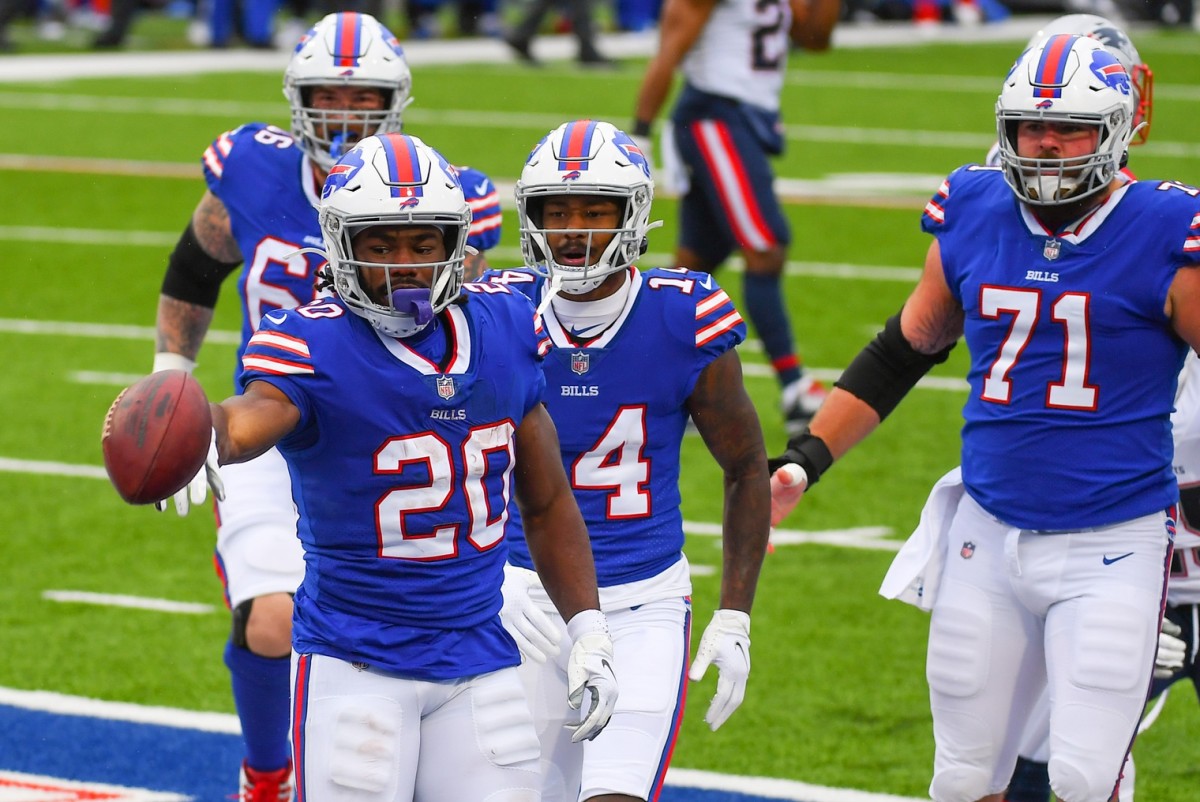 Nov 1, 2020; Orchard Park, New York, USA; Buffalo Bills running back Zack Moss (20) reacts to his touchdown run against the New England Patriots during the first quarter at Bills Stadium.
