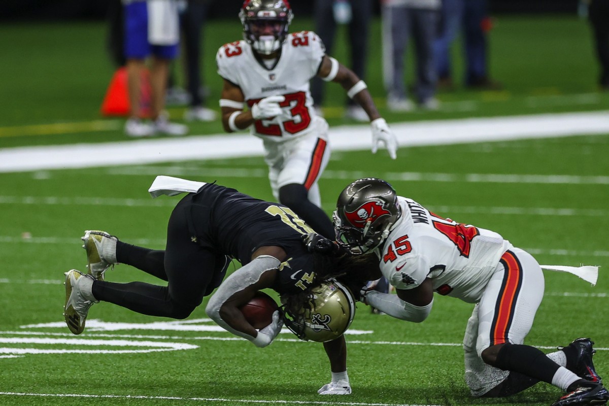 Sep 13, 2020; New Orleans, Louisiana, USA; New Orleans Saints running back Alvin Kamara (41) is tackled by Tampa Bay Buccaneers linebacker Lavonte David (54) during the first quarter at the Mercedes-Benz Superdome. Mandatory Credit: Derick E. Hingle-USA TODAY 