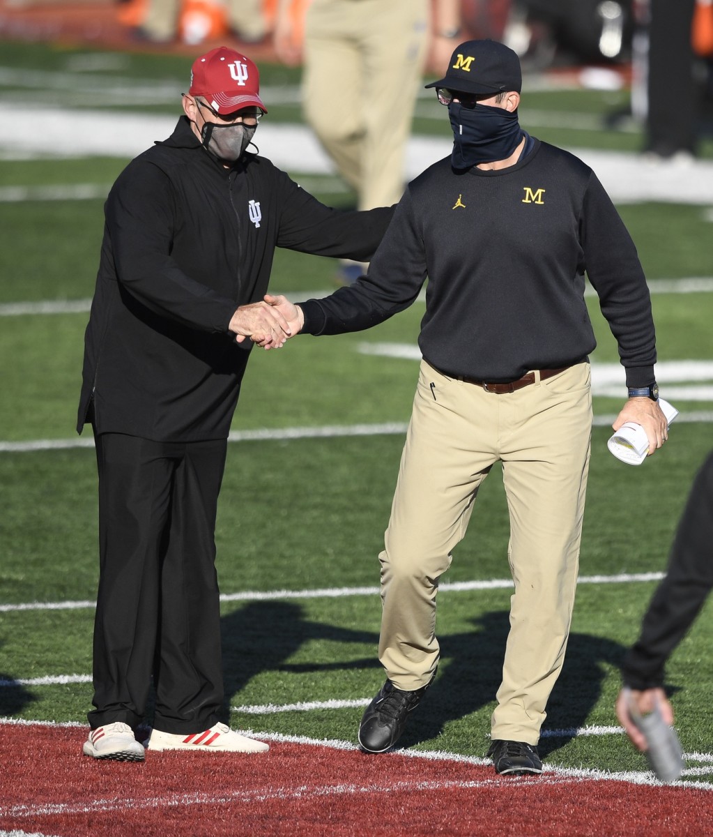 Indiana coach Tom Allen shakes the hand of Michigan coach Jim Harbaugh after the game. Indiana  defeated Michigan Wolverines, 38-21. (Marc Lebryk-USA TODAY Sports)