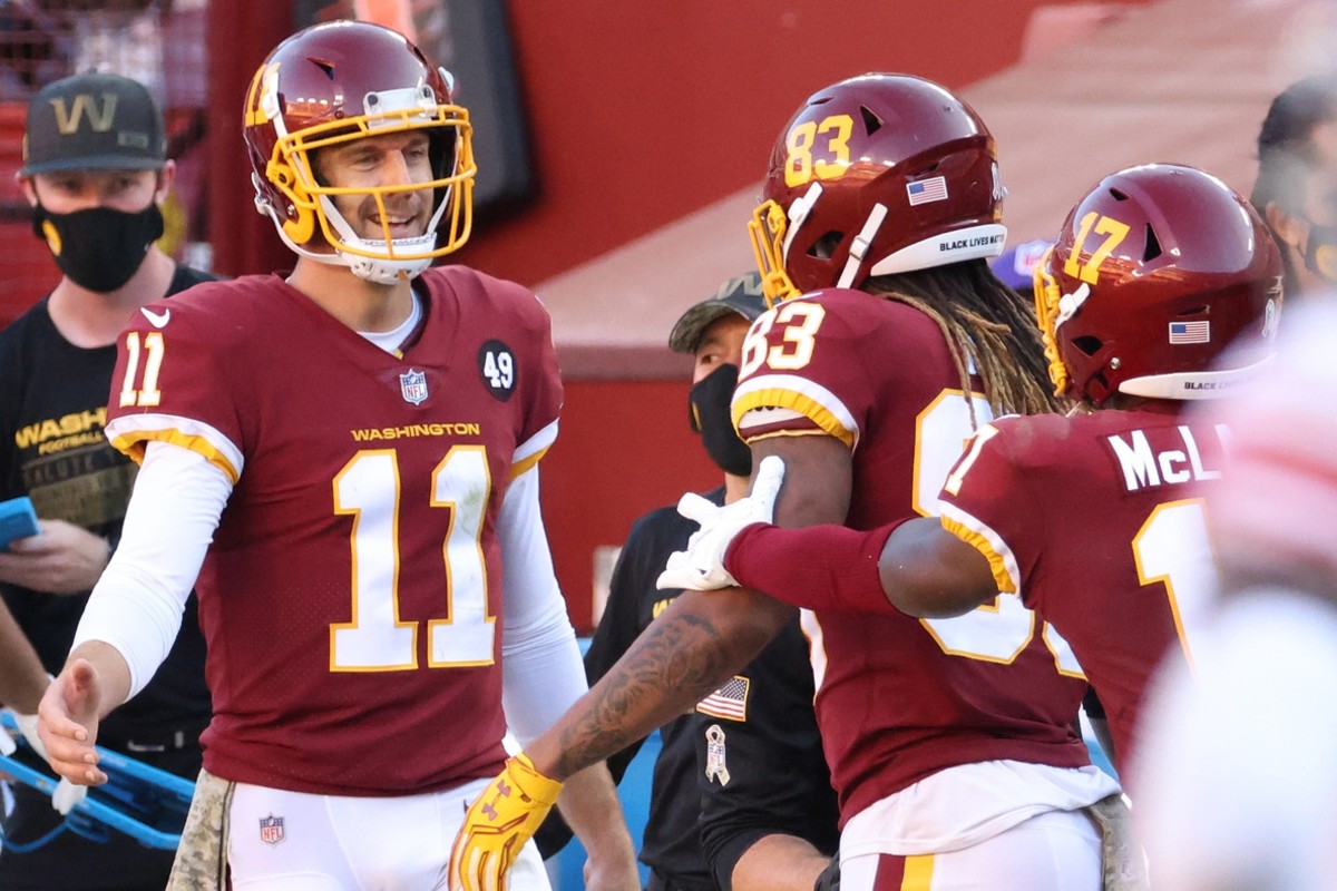 Nov 8, 2020; Landover, Maryland, USA; Washington Football Team quarterback Alex Smith (11) celebrates with Washington Football Team wide receiver Terry McLaurin (17) after the two connected on a touchdown pass against the New York Giants in the fourth quarter at FedEx Field.