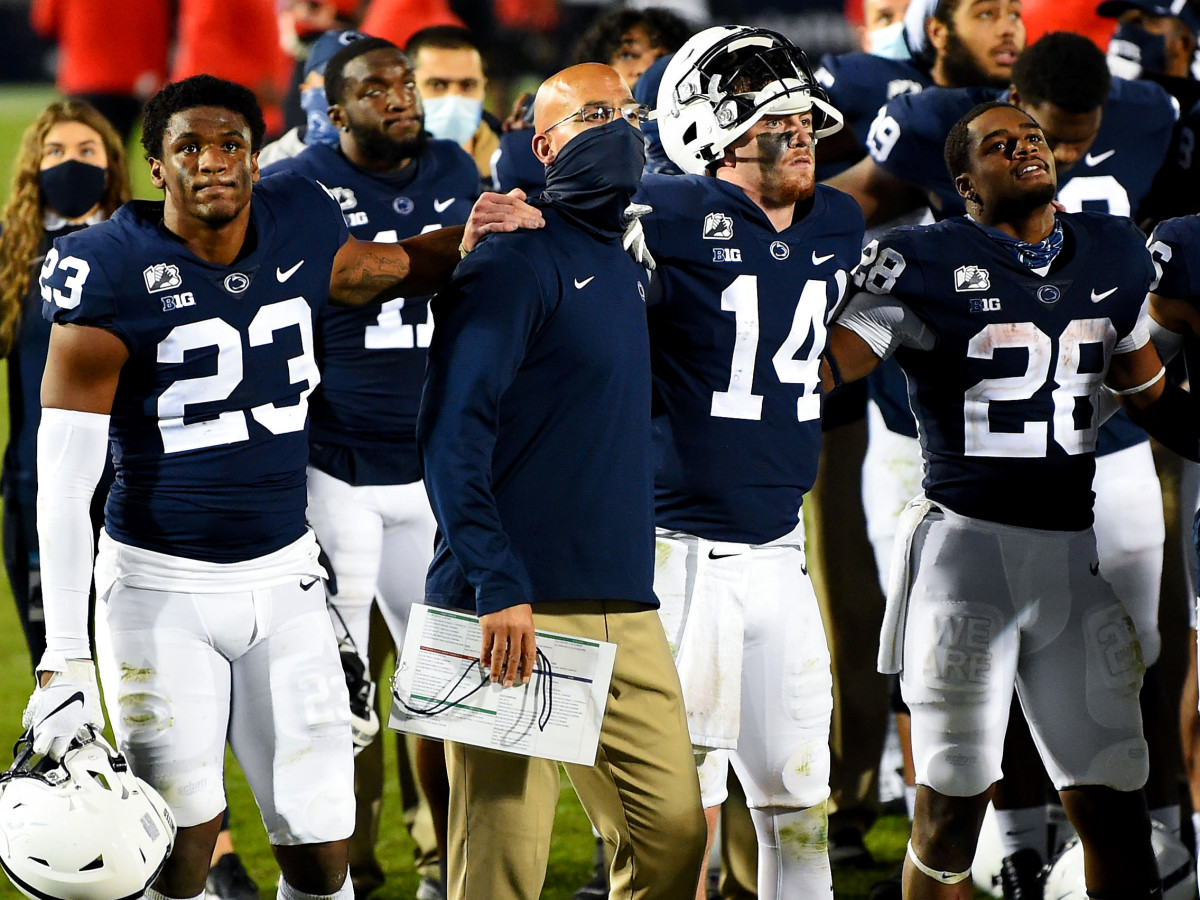 Nov 7, 2020; University Park, Pennsylvania, USA; Penn State Nittany Lions head coach James Franklin stands with quarterback Sean Clifford (14) during the playing of the alma mater following the game against the Maryland Terrapins at Beaver Stadium.