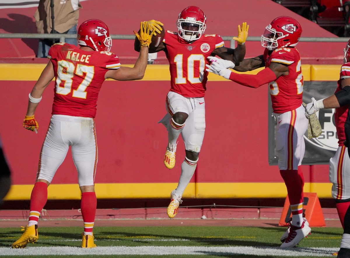 Nov 8, 2020; Kansas City, Missouri, USA; Kansas City Chiefs wide receiver Tyreek Hill (10) celebrates with tight end Travis Kelce (87) and running back Clyde Edwards-Helaire (25) after scoring against the Carolina Panthers during the second half at Arrowhead Stadium. Mandatory Credit: Denny Medley-USA TODAY Sports