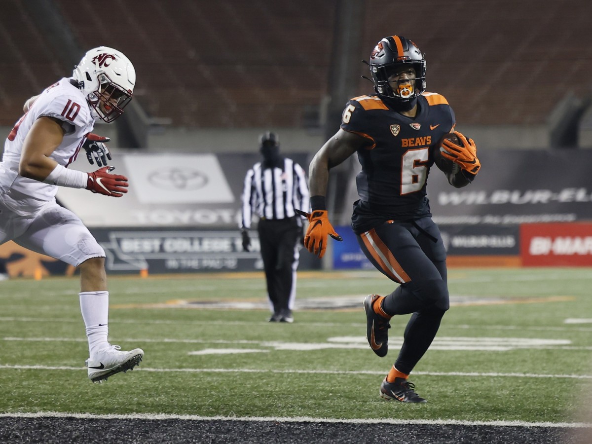 Nov 7, 2020; Corvallis, Oregon, USA; Oregon State Beavers running back Jermar Jefferson (6) runs into the end zone for a touchdown agains the Washington State Cougars during the second half at Reser Stadium.