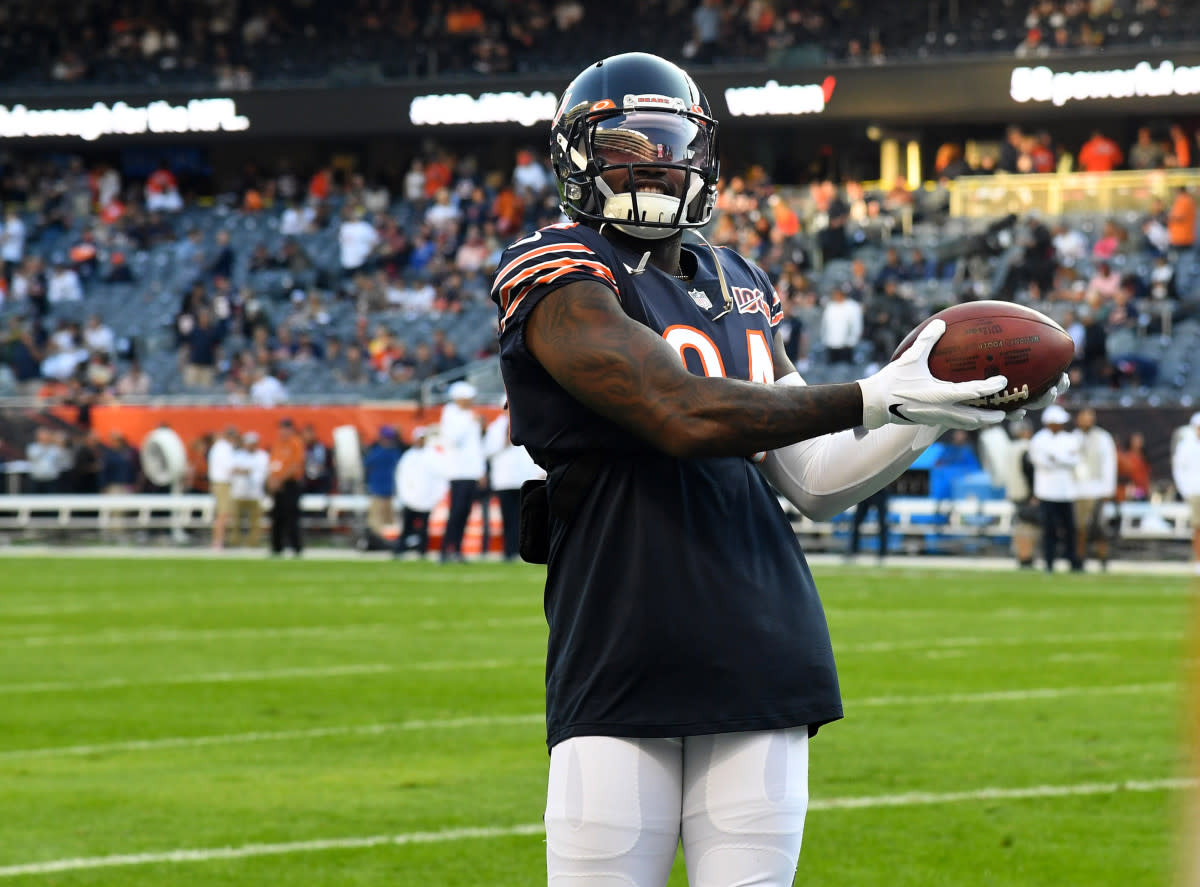 Bears wide receiver Cordarrelle Patterson (84) plays catch with fans in the stands prior to a 2019 game against the Packers at Soldier Field.