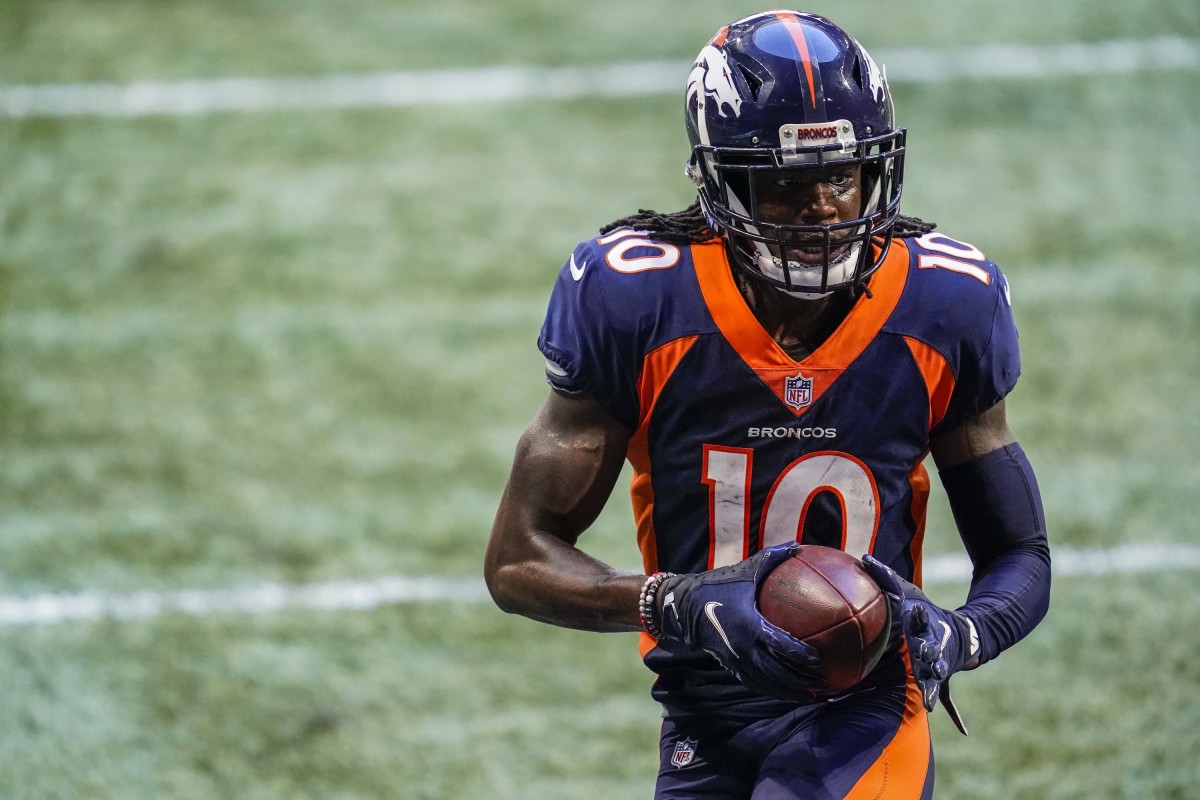 Denver Broncos wide receiver Jerry Jeudy (10) scores a touchdown against the Atlanta Falcons after making a catch during the second half at Mercedes-Benz Stadium.