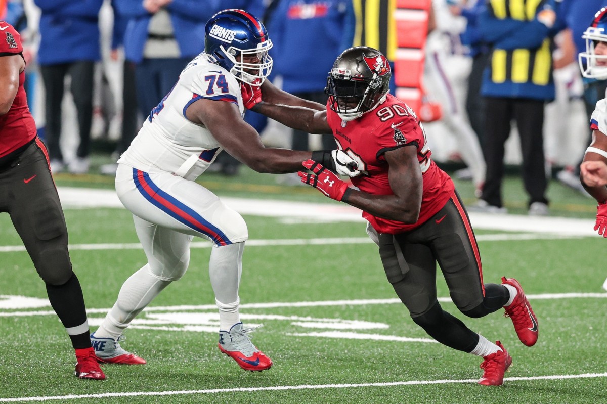Nov 2, 2020; East Rutherford, New Jersey, USA; Tampa Bay Buccaneers outside linebacker Jason Pierre-Paul (90) is blocked by New York Giants offensive tackle Matt Peart (74) during the first half at MetLife Stadium.