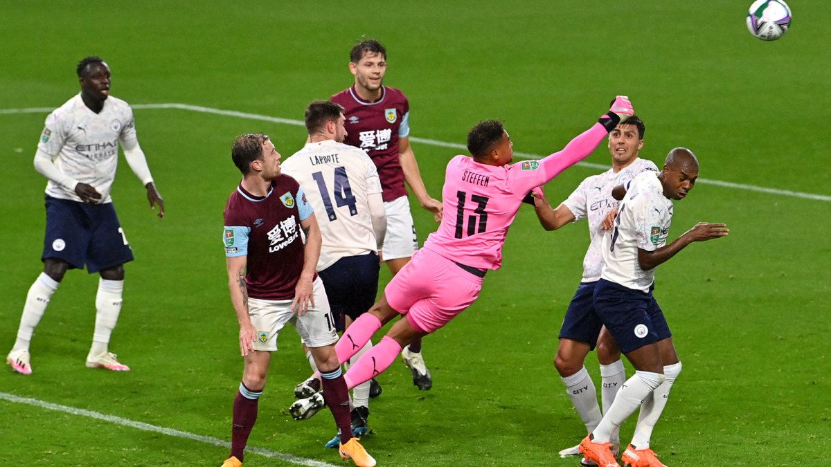 Zack Steffen makes a save for Man City