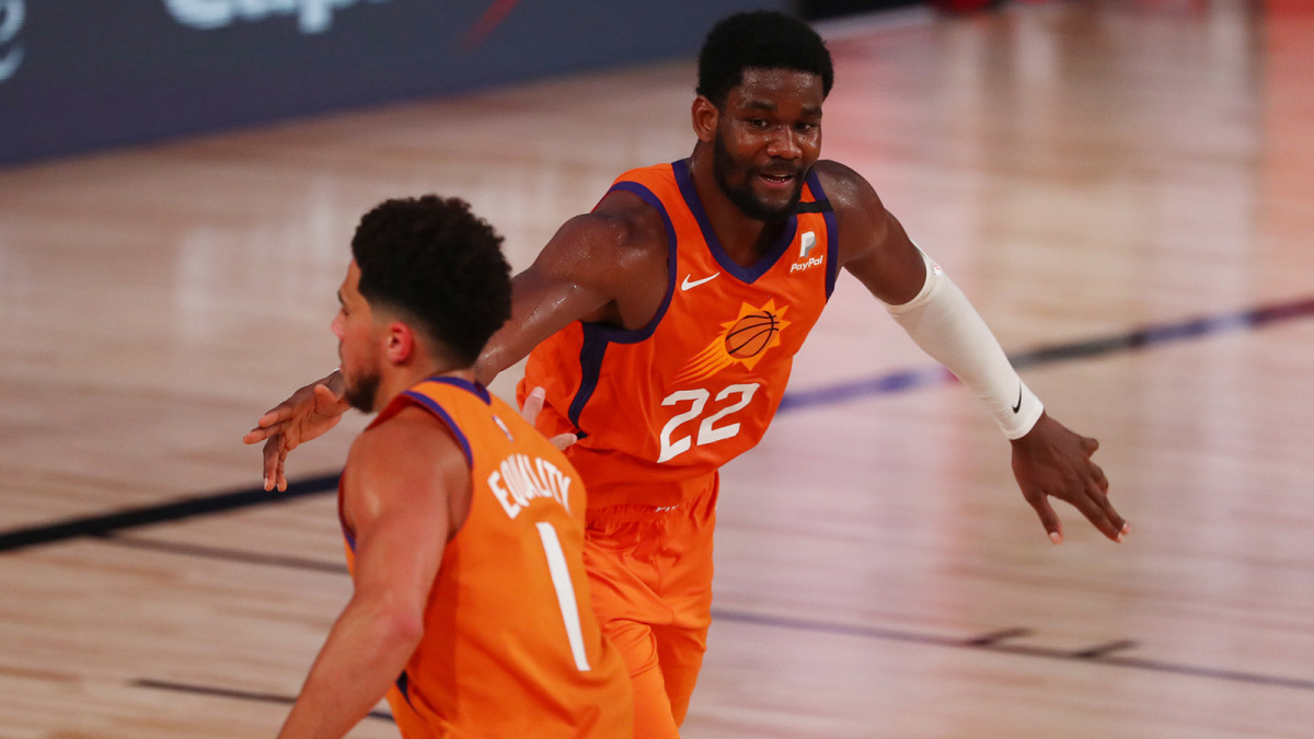 Phoenix Suns center Deandre Ayton is congratulated by guard Devin Booker