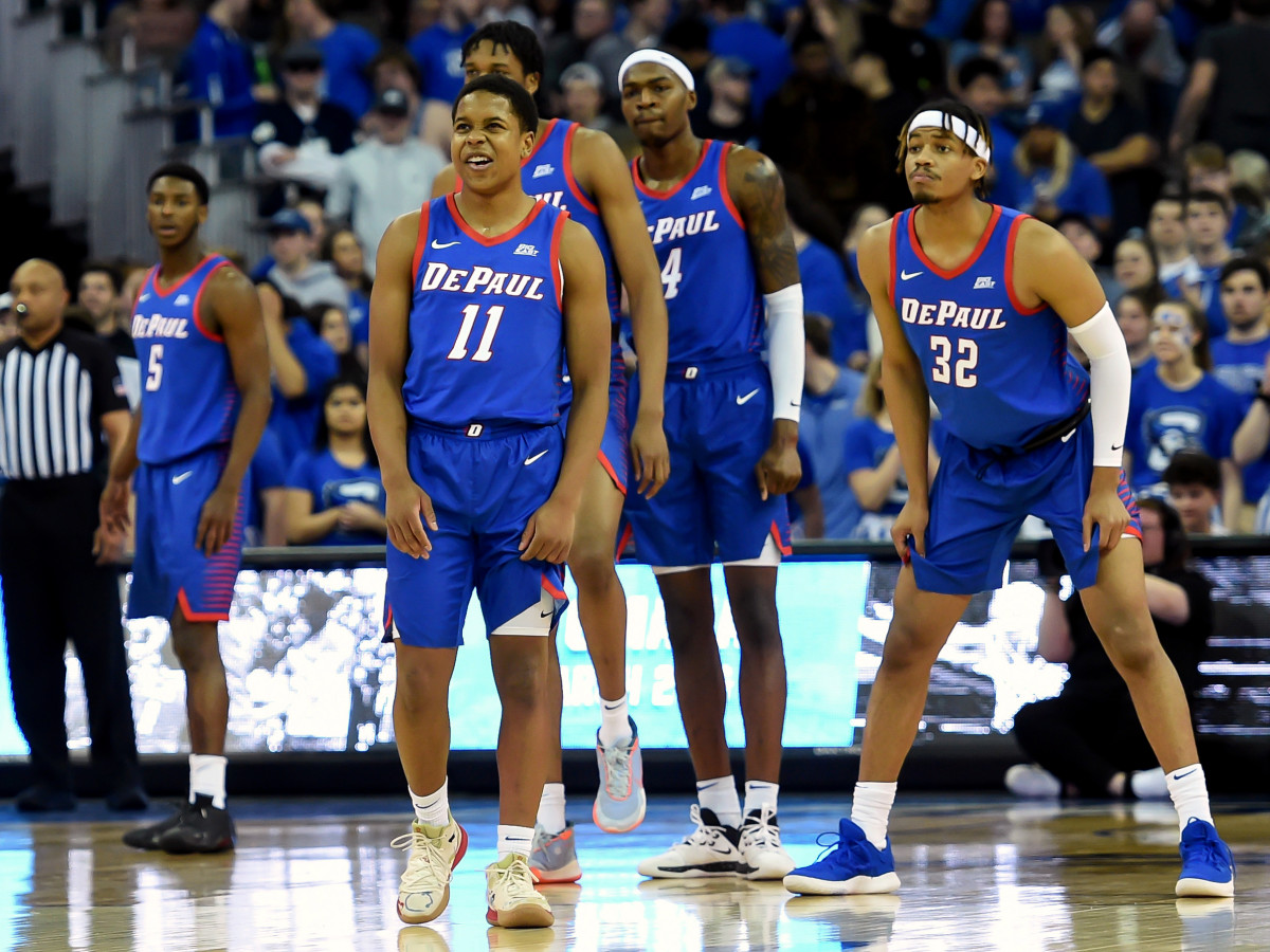 Feb 15, 2020; Omaha, Nebraska, USA;  DePaul Blue Demons guard Charlie Moore (11) lead his teammates onto the court against the Creighton Bluejays in the first half at CHI Health Center Omaha.