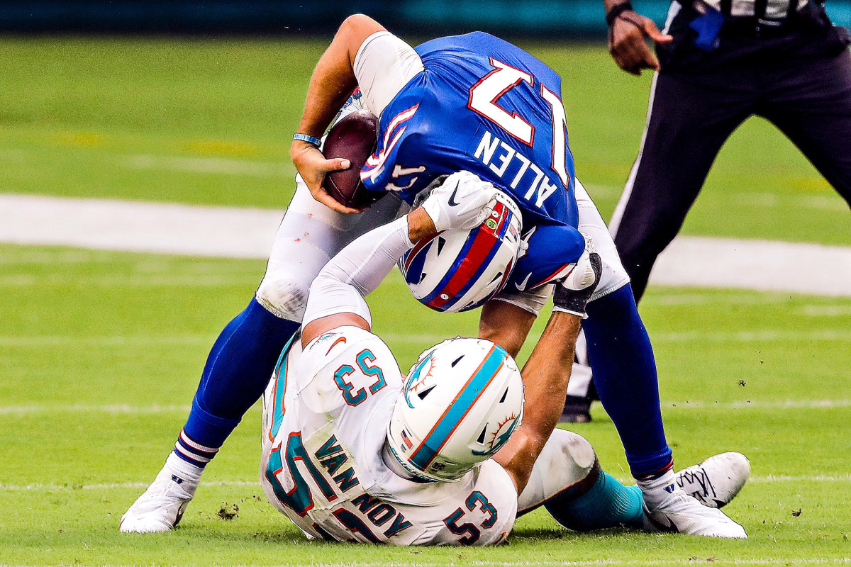 Josh Allen breaks a tackle of Dolphins LB Kyle Van Noy