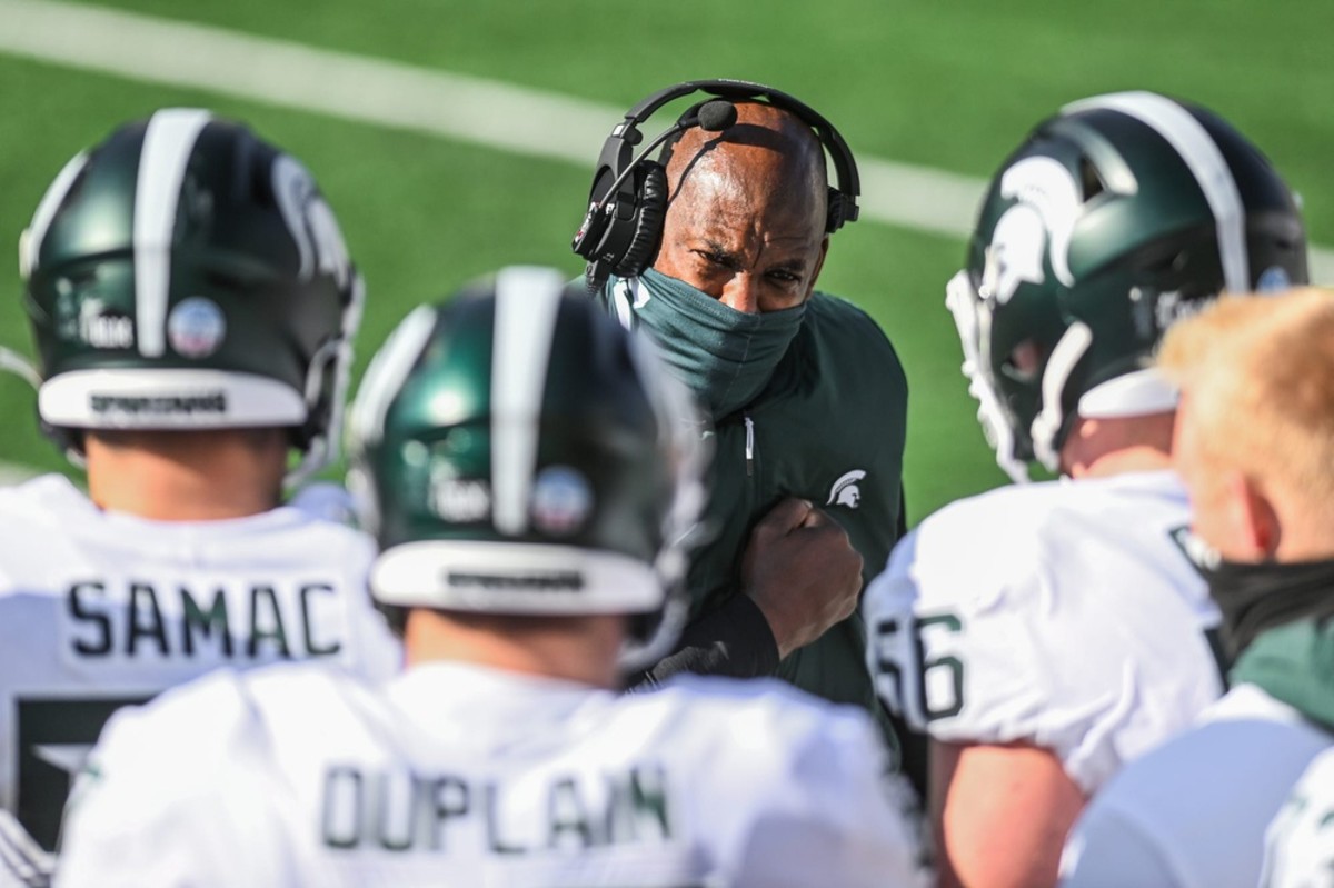 Michigan State coach Mel Tucker talks with the offensive line during the Spartans' game against Michigan on Oct. 31. (Nick King/Lansing State-Journal)