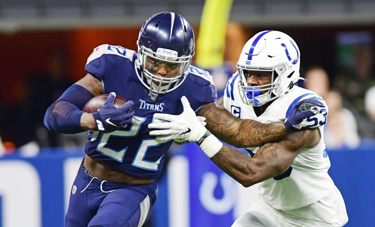Tennessee Titans running back Derrick Henry tries to fend off Indianapolis Colts linebacker Darius Leonard in a 2019 road win at Lucas Oil Stadium.