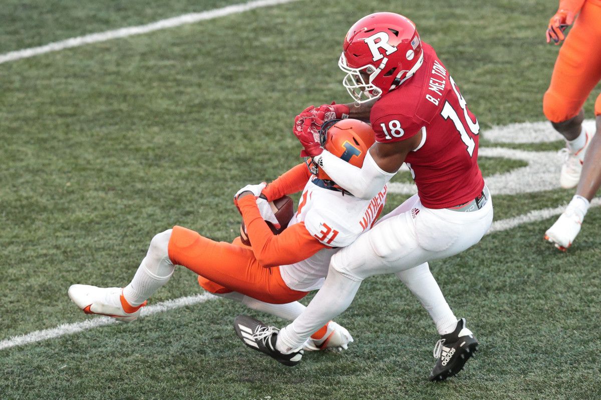 Illinois Fighting Illini defensive back Devon Witherspoon (31) intercepts a pass intended for Rutgers Scarlet Knights wide receiver Bo Melton (18) during the second half at SHI Stadium.