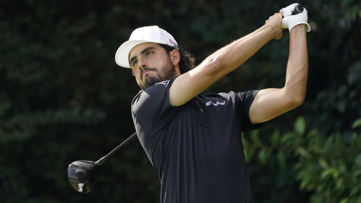 Abraham Ancer plays his shot from the 14th tee during the final round of The Masters golf tournament at Augusta National GC.
