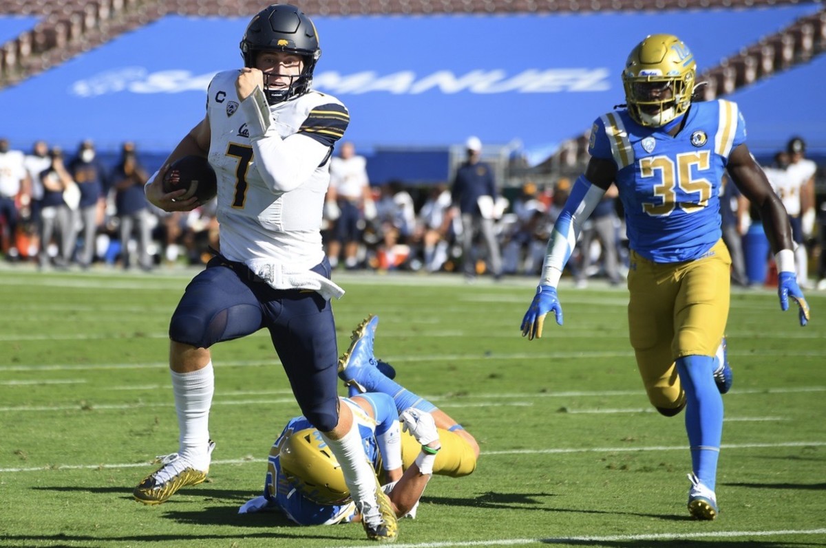 Chase Garbers scrambles for a touchdown against UCLA