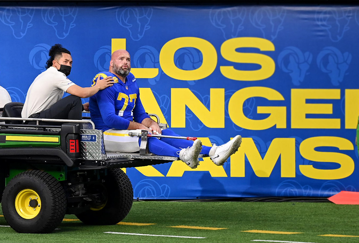 Andrew Whitworth looks up as he's carted off the field after suffering a knee injury against the Seahawks