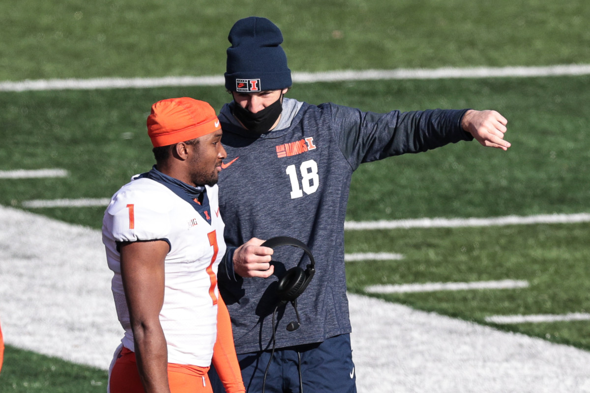 Illinois Fighting Illini quarterback Isaiah Williams (1) talks with quarterback Brandon Peters (18) during the first half against the Rutgers Scarlet Knights at SHI Stadium.