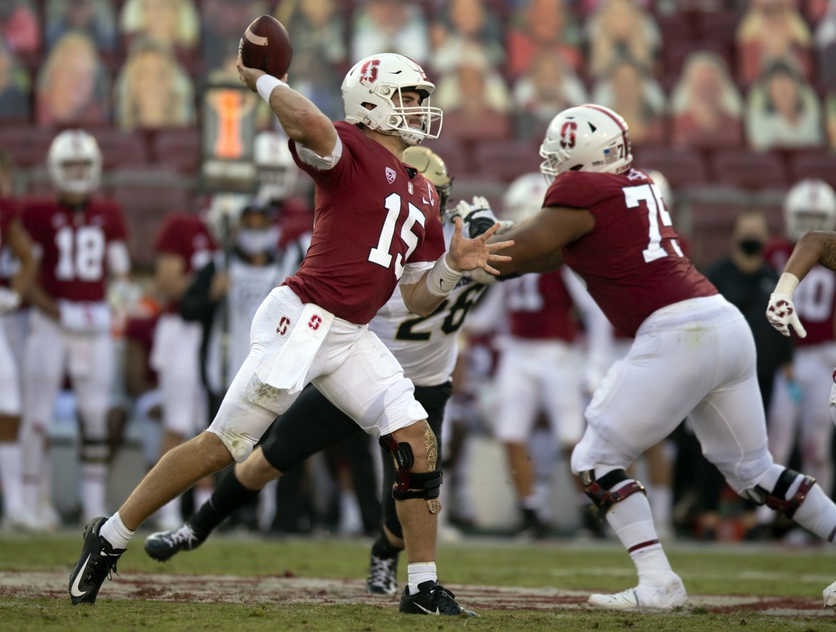 Nov 14, 2020; Stanford, California, USA; Stanford Cardinal quarterback Davis Mills (15) passes against the Colorado Buffaloes during the fourth quarter of an NCAA college football game at Stanford Stadium.