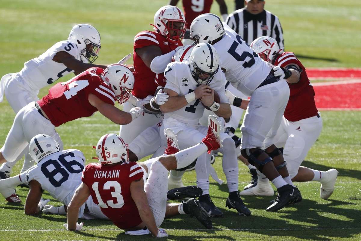 Nebraska defenders tackle Penn State quarterback Will Levis (7) during the Cornhuskers' win last Saturday. (Bruce Thorson/USA TODAY Sports)