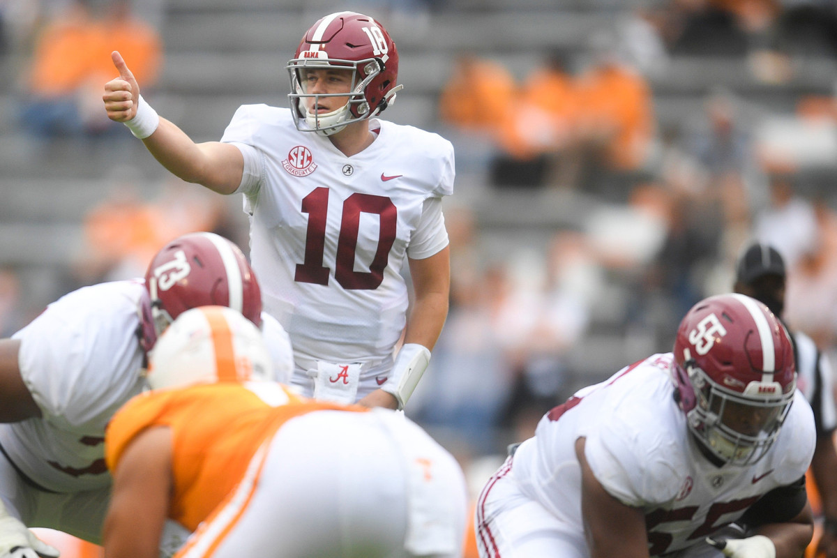 Alabama QB Mac Jones signals to a teammate before a play
