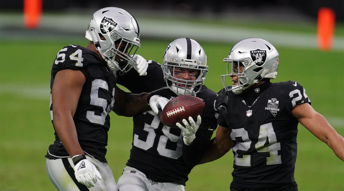 Nov 15, 2020; Paradise, Nevada, USA; Las Vegas Raiders strong safety Jeff Heath (38) celebrates with middle linebacker Raekwon McMillan (54) and strong safety Johnathan Abram (24) after intercepting a pass in the second quarter against the Denver Broncos at Allegiant Stadium. Mandatory Credit: Kirby Lee-USA TODAY Sports