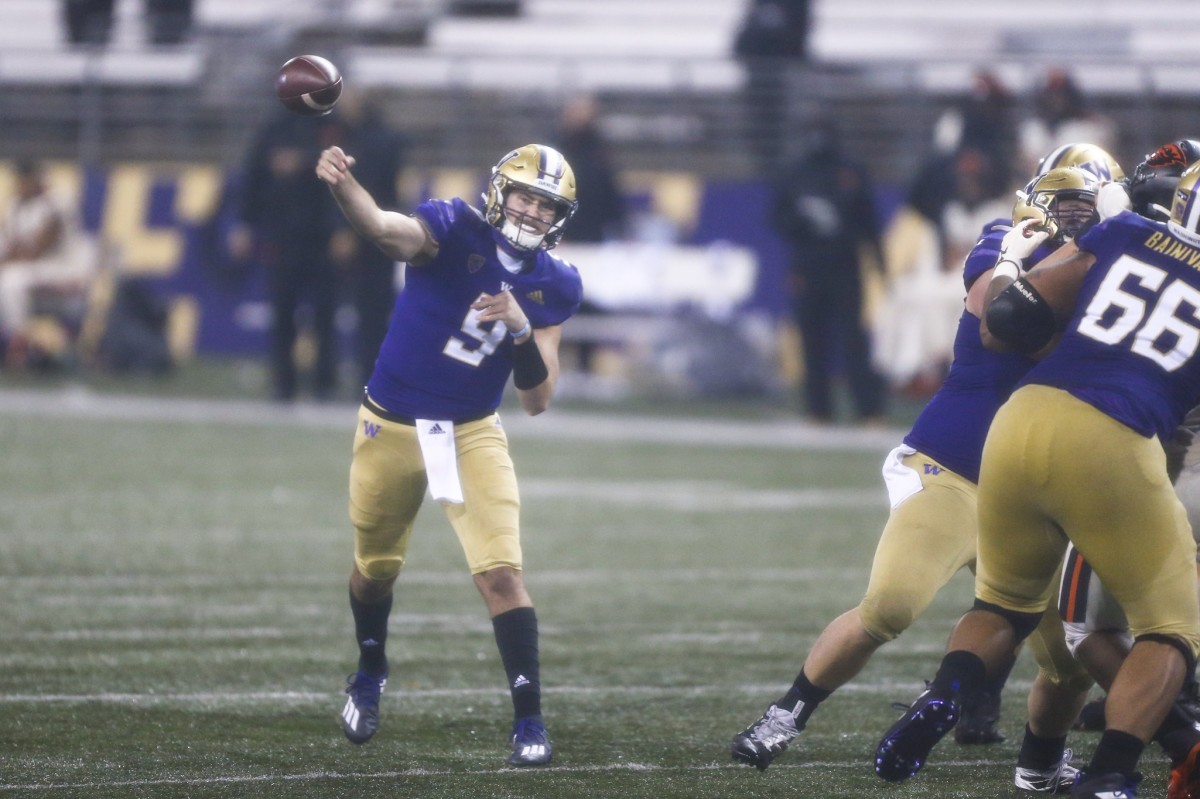 Nov 14, 2020; Seattle, Washington, USA; Washington Huskies quarterback Dylan Morris (9) passes against the Oregon State Beavers during the second quarter at Alaska Airlines Field at Husky Stadium.