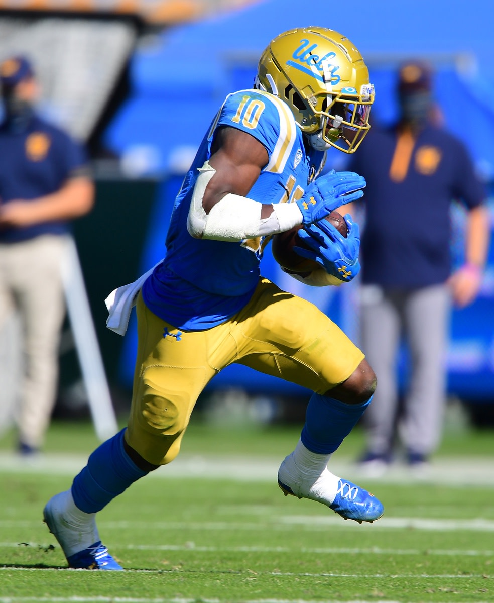 Nov 15, 2020; Pasadena, California, USA; UCLA Bruins running back Demetric Felton (10) runs against the California Golden Bears in the second half at the Rose Bowl.