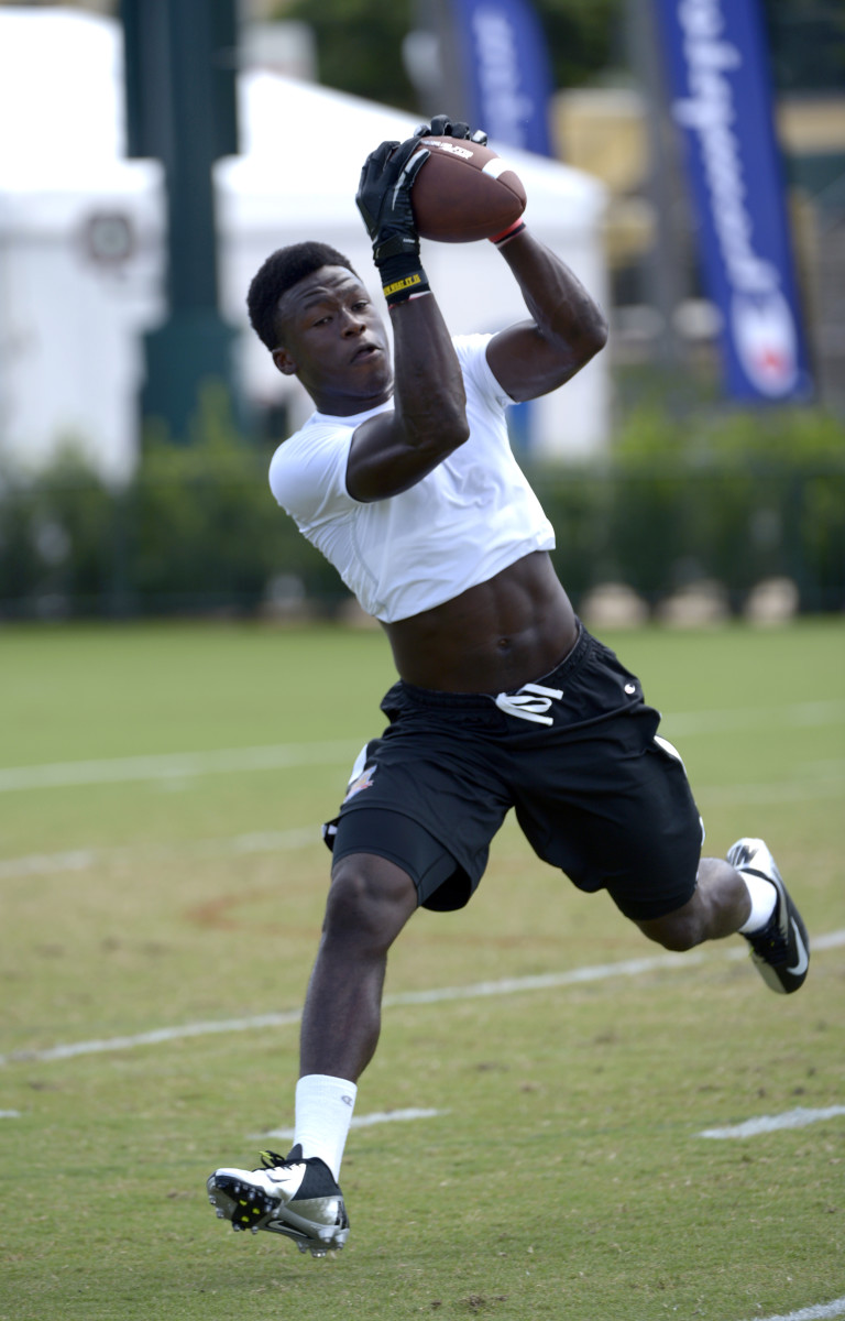 Running back Alvin Kamara, of Norcross, Ga., catches a pass during a practice for the Champion Gridiron Kings
