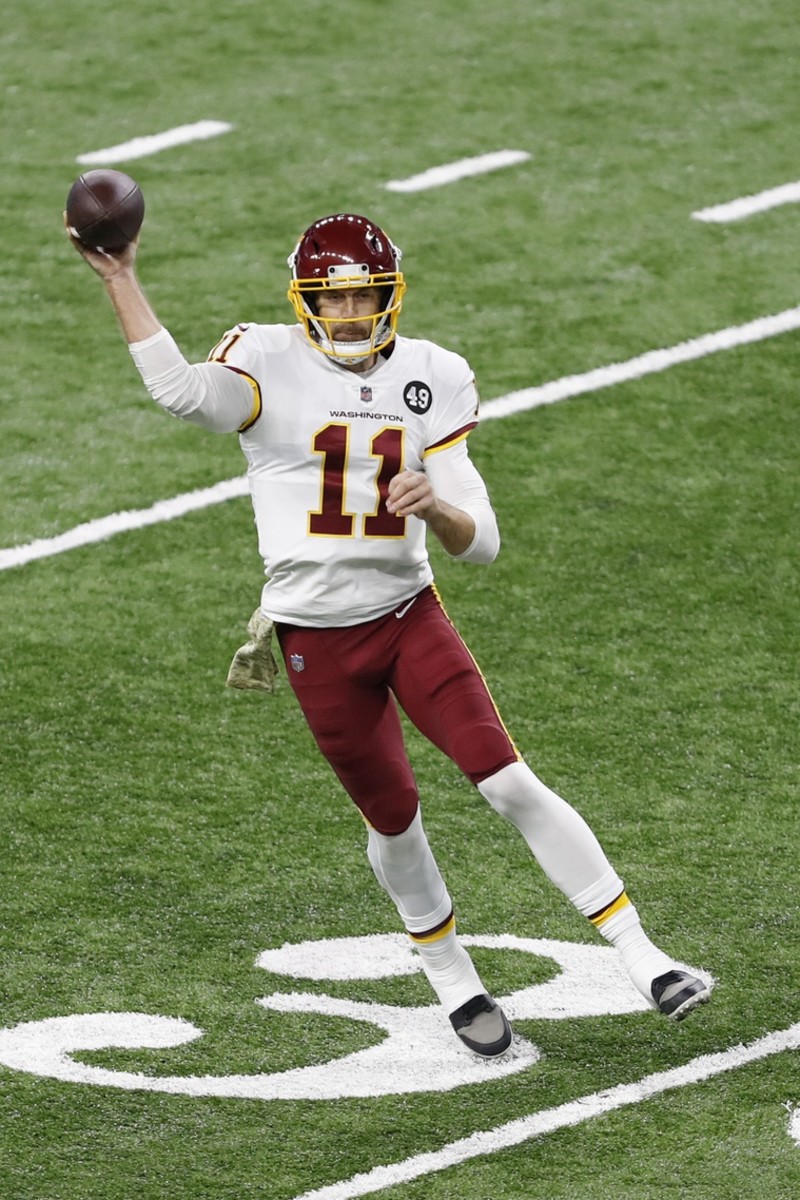 Nov 15, 2020; Detroit, Michigan, USA; Washington Football Team quarterback Alex Smith (11) passes the ball against the Detroit Lions during the first quarter at Ford Field