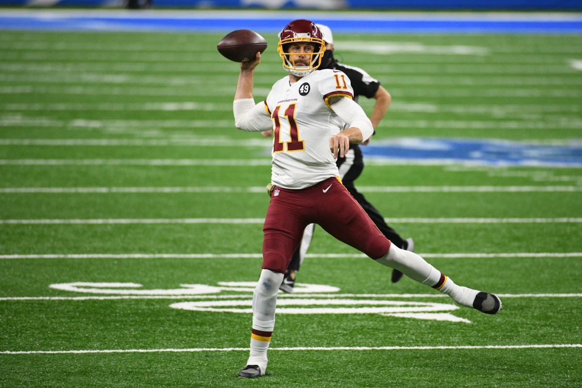 Nov 15, 2020; Detroit, Michigan, USA; Washington Football Team quarterback Alex Smith (11) throws a pass against the Detroit Lions during the third quarter at Ford Field.