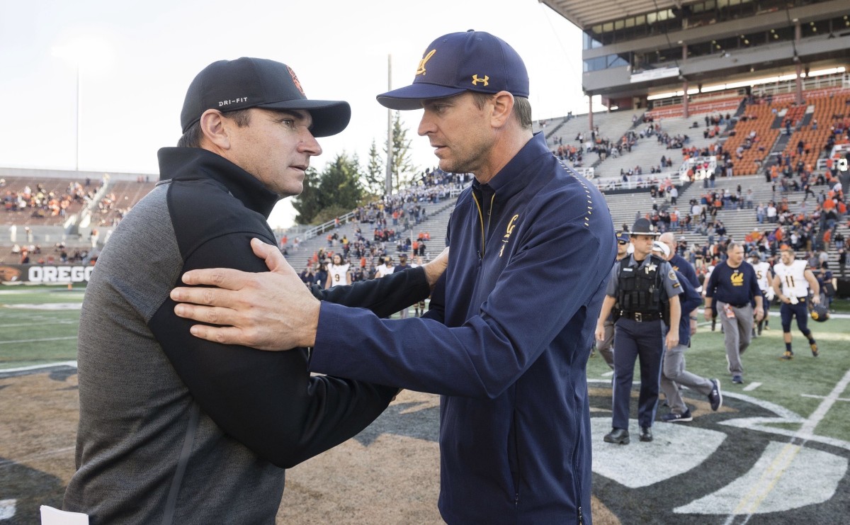 Oregon State coach Jonathan Smith greets Cal's Justin Wilcox at Reser Stadium